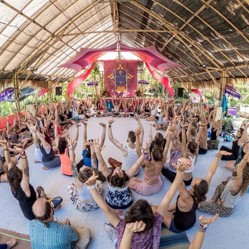 Group doing light stretching in a park circle